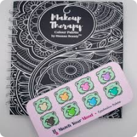 Eye make up paletter shown with make up therapy ring bound book